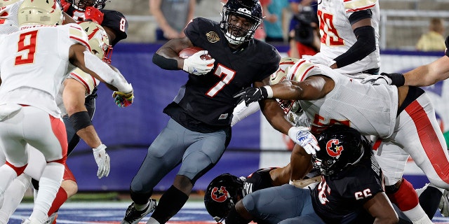 Mark Thompson #7 of Houston Gamblers runs with the ball in the fourth quarter of the game against the Birmingham Stallions at Protective Stadium on April 23, 2022 in Birmingham, Alabama. 