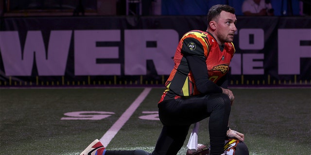 Johnny Manziel #2 of Zappers kneels before the game against the Glacier Boyz during Fan Controlled Football Season v2.0 - Week Two on April 23, 2022 in Atlanta, Georgia.