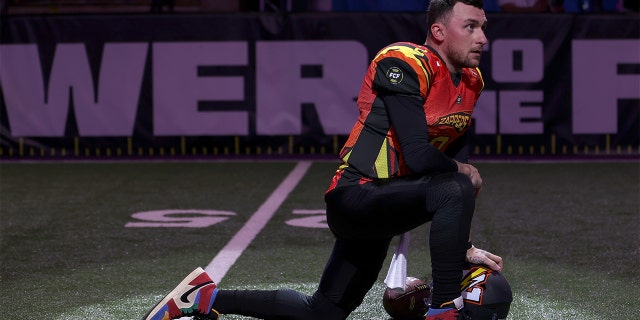 Johnny Manziel #2 of Zappers kneels before the game against the Glacier Boyz during Fan Controlled Football Season v2.0 - Week Two on April 23, 2022 in Atlanta, Georgia.