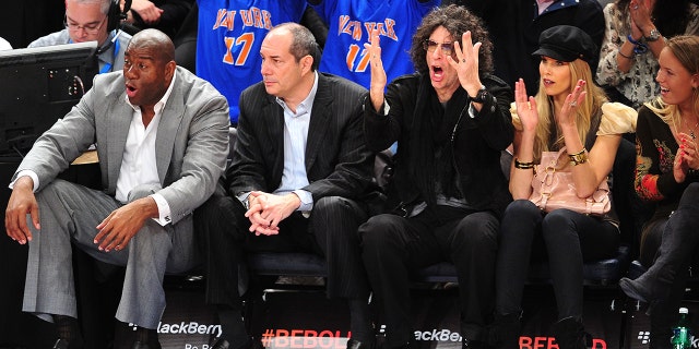 Magic Johnson and Howard Stern sit near each other at a Cleveland Cavaliers-New York Knicks game at Madison Square Garden on Feb. 29, 2012, in New York City.