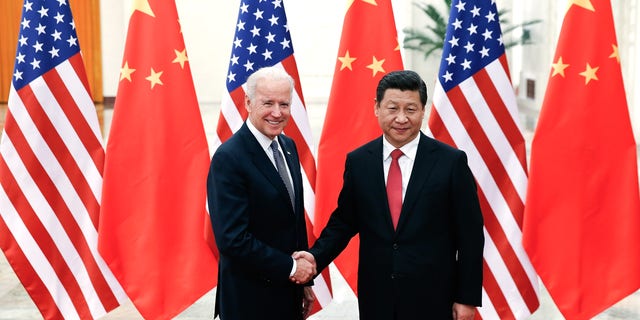 BEIJING, CHINA - DECEMBER 04:  Chinese President Xi Jinping (R) shake hands with   U.S Vice President Joe Biden (L) inside the Great Hall of the People on December 4, 2013 in Beijing, China. U.S Vice President Joe Biden will pay an official visit to China from December 4 to 5.  (Photo by Lintao Zhang/Getty Images)
