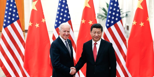 BEIJING, CHINA - DECEMBER 04: Chinese President Xi Jinping (R) shake hands with U.S Vice President Joe Biden (L) inside the Great Hall of the People on December 4, 2013 in Beijing, China. U.S Vice President Joe Biden will pay an official visit to China from December 4 to 5. (Photo by Lintao Zhang/Getty Images)