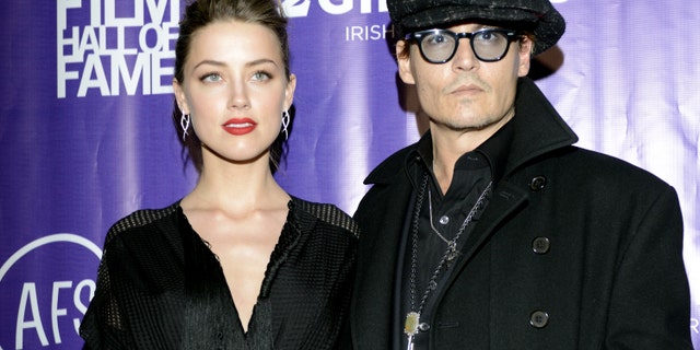 Amber Heard and Johnny Depp arrive at the 2014 Texas Film Awards.