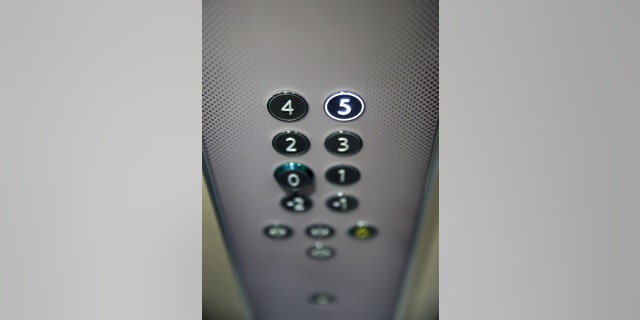 Floor buttons on elevator panel. 