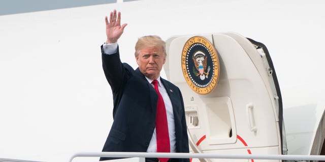 President Trump waves while boarding Air Force One before traveling for a rally in Indiana at Joint Base Andrews, Maryland, U.S., May 10, 2018.