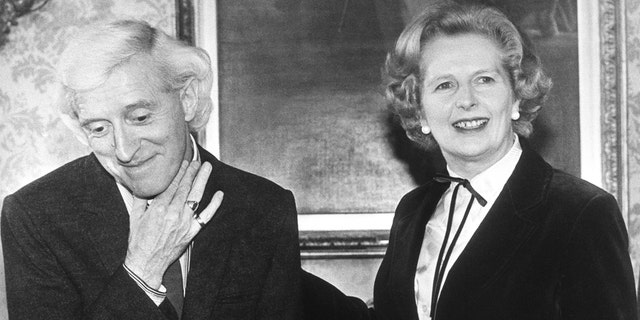 Prime Minister Margaret Thatcher meeting Jimmy Savile. The TV host presented her with a check to be handed over to the NSPCC. It was part of the money he raised for charity.