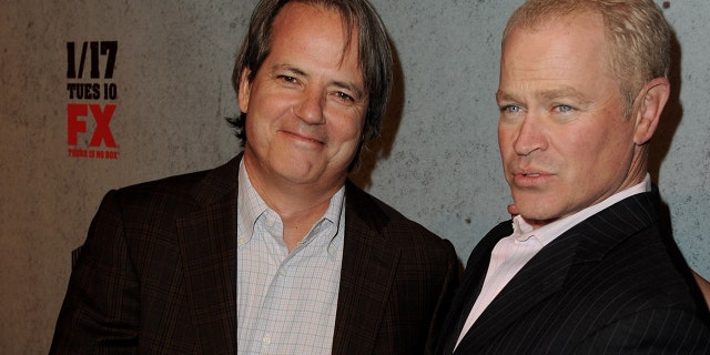 Executive producer Graham Yost (left) and actor Neal McDonough arrive at the premiere of FX Networks and Sony Pictures Television's "Justified" Season 3 at the Directors Guild Jan. 10, 2012, in Los Angeles.