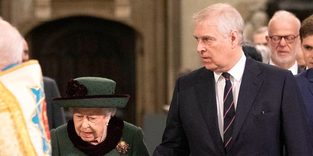 Queen Elizabeth II and Prince Andrew arrive to attend a Service of Thanksgiving for Prince Philip at Westminster Abbey in London on March 29, 2022.