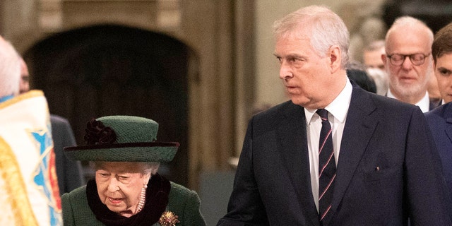 Britain's Queen Elizabeth II and Britain's Prince Andrew, Duke of York, arrive for the Service of Thanksgiving honoring Prince Philip at Westminster Abbey on March 29, 2022.