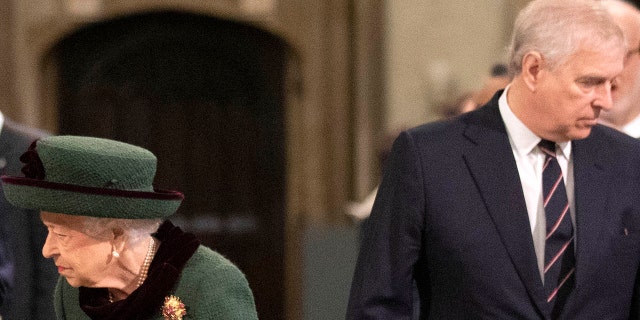 Queen Elizabeth II arrives in Westminster Abbey accompanied by Prince Andrew for the service honoring Prince Philip on March 29, 2022.