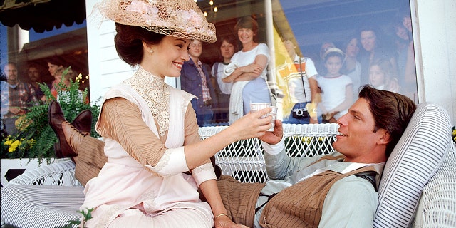 Jane Seymour and Christopher Reeve take a break during filming of "Somewhere in Time" on the veranda of the Grand Hotel in Mackinac Island, Michigan, in May 1979.