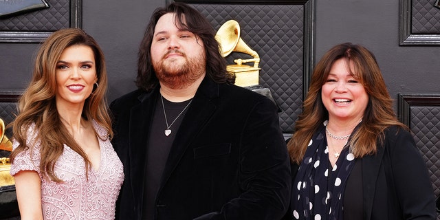 (L-R) Andraia Allsop, Wolfgang Van Halen and Valerie Bertinelli attend the 64th annual Grammy Awards.