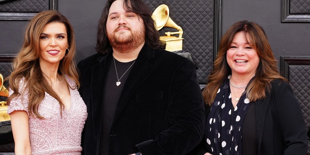 (L-R) Andraia Allsop, Wolfgang Van Halen and Valerie Bertinelli attend the 64th annual Grammy Awards.