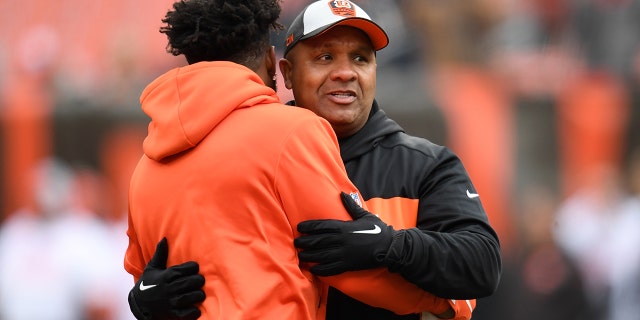 Special assistant to the head coach Hue Jackson of the Cincinnati Bengals talks with Jarvis Landry of the Cleveland Browns prior to the game at FirstEnergy Stadium on Dec. 23, 2018 in Cleveland, Ohio.