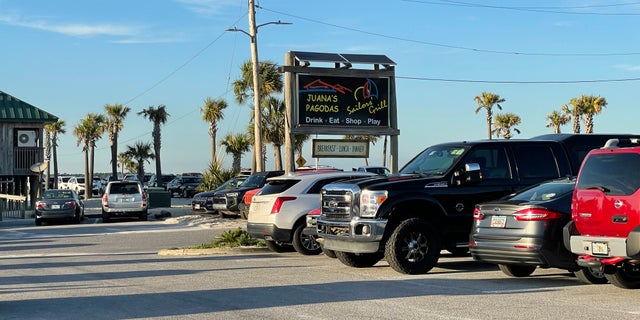 A sign for Juana's Pagodas, the restaurant where Cassie and her child's father met in the parking lot.