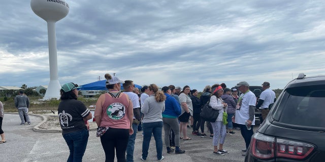 Volunteers gather in Navarre Beach, Florida, to receive instructions before beginning their search for Cassie Carli, April 2, 2022