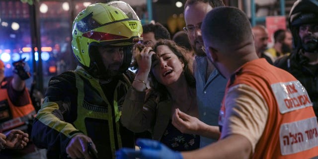 Reuters dragged for 'evil', 'woeful' headline on terrorist attack that killed Israeli twos A woman reacts at the scene of a shooting attack In Tel Aviv, Israel, Thursday, April 7, 2022. Israeli health officials say two people were killed and at least eight others wounded in a shooting in central Tel Aviv. The shooting on Thursday evening, the fourth attack in recent weeks, occurred in a crowded area with several bars and restaurants. (AP Photo/Ariel Schalit). (AP Photo/Ariel Schalit)
