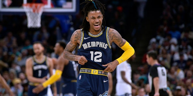 Memphis Grizzlies guard Ja Morant (12) reacts during the second half of Game 2 of a first round NBA basketball playoff series against the Minnesota Timberwolves on Tuesday, April 19, 2022, in Memphis, Tennessee.