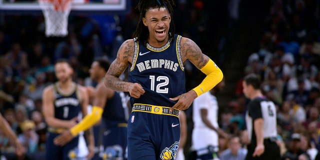 Memphis Grizzlies guard Ja Morant (12) reacts during the second half of Game 2 of a first round NBA basketball playoff series against the Minnesota Timberwolves on Tuesday, April 19, 2022 in Memphis, Tennessee.