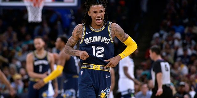 Memphis Grizzlies guard Ja Morant (12) reacts during the second half of Game 2 of a first round NBA basketball playoff series against the Minnesota Timberwolves on Tuesday, April 19, 2022, in Memphis, Tennessee.