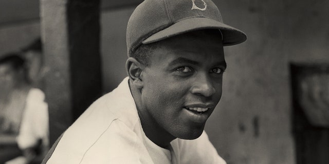 A portrait of the Brooklyn Dodgers' infielder Jackie Robinson in uniform in 1945.
