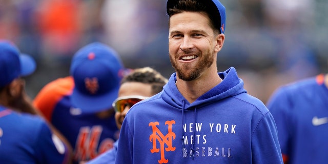 FILE - New York Mets pitcher Jacob DeGrom smiles after the team's baseball game against the Washington Nationals on Aug. 29, 2021, in New York. In his first start since last summer, the two-time Cy Young Award winner fired two innings of one-hit ball in New York's 2-0 victory over the Houston Astros in a preseason game Tuesday, March 22.