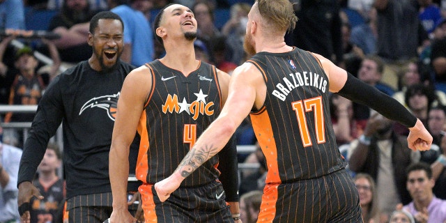 Orlando Magic forward Ignas Brazdeikis (17) celebrates with guard Jalen Suggs (4) during the second half against the Cleveland Cavaliers on April 5, 2022, in Orlando, Florida.