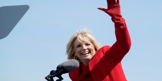 U.S. first lady Jill Biden waves at a commemorative commissioning ceremony for the USS Delaware nuclear submarine at the Port of Wilmington, Del., April 2, 2022. 