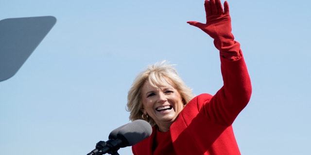 U.S. first lady Jill Biden waves at a commemorative commissioning ceremony for the USS Delaware nuclear submarine at the Port of Wilmington, Del., April 2, 2022.