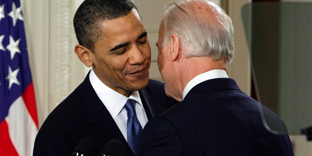 Then-Vice President Joe Biden whispers "This is a big f------ deal," to President Barack Obama after introducing Obama during the health care bill ceremony in the East Room of the White House in Washington, March 23, 2010.