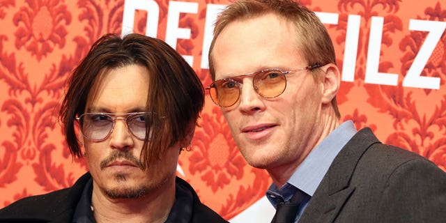 Johnny Depp and British actor Paul Bettany arrive for the premiere of their new film 'Mortdecai' at the Zoopalast cinema in Berlin, Germany, Jan. 18, 2015.