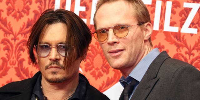 Johnny Depp and British actor Paul Bettany arrive for the premiere of their new film 'Mortdecai' at the Zoopalast cinema in Berlin, Germany, Jan. 18, 2015.