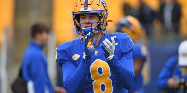 Kenny Pickett #8 of the Pittsburgh Panthers warms up before the game against the Miami Hurricanes at Heinz Field on October 30, 2021 in Pittsburgh, Pennsylvania.