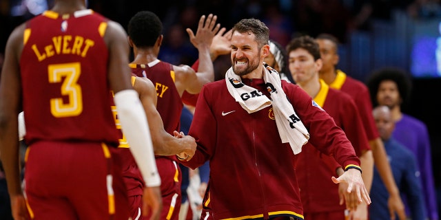 Kevin Love of the Cleveland Cavaliers hi-fives teammates during the game against the LA Clippers on March 14, 2022 at Rocket Mortgage FieldHouse in Cleveland, Ohio.