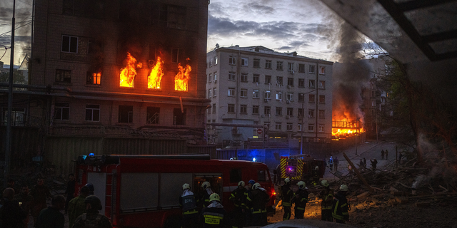 First responders work at the site where fires were triggered by an explosion in Kyiv, Ukraine, on Thursday, April 28.