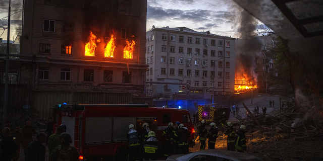 First responders work at the site where fires were triggered by an explosion in Kyiv, Ukraine, on Thursday, April 28.