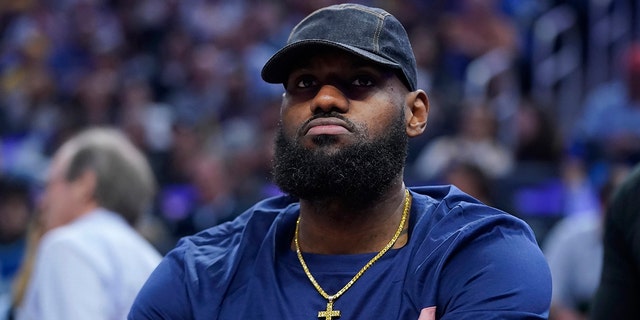 LeBron James of the Los Angeles Lakers sits on the bench during the first half of a game against the Golden State Warriors in San Francisco on April 7, 2022.