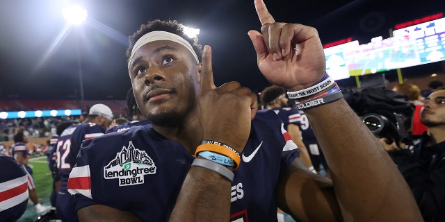 Malik Willis #7 of the Liberty Flames reacts during the LendingTree Bowl at Hancock Whitney Stadium on December 18, 2021 in Mobile, Alabama.