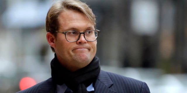 Mark Riddell arrives at federal court in Boston on April 12, 2019.