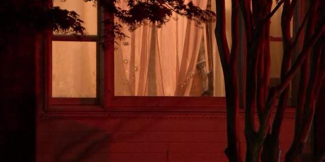 Several of the bullets were fired through the window of the home when two gunmen opened fire on a man who answered his front door early Thursday.