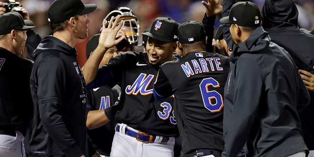 New York Mets pitcher Edwin Diaz (39) celebrates with teammates after a baseball game against the Philadelphia Phillies on Friday, April 29, 2022 in New York City.  The Mets won 3-0 on a no-hitter combined.  (AP Photo/Adam Hunger)