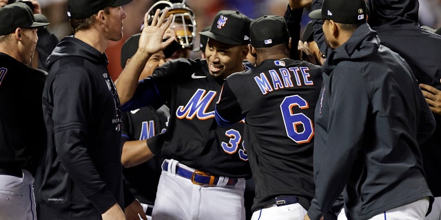 New York Mets pitcher Edwin Diaz (39) celebrates with teammates after a baseball game against the Philadelphia Phillies on Friday, April 29, 2022, in New York. The Mets won 3-0 on a combined no-hitter. (AP Photo/Adam Hunger)