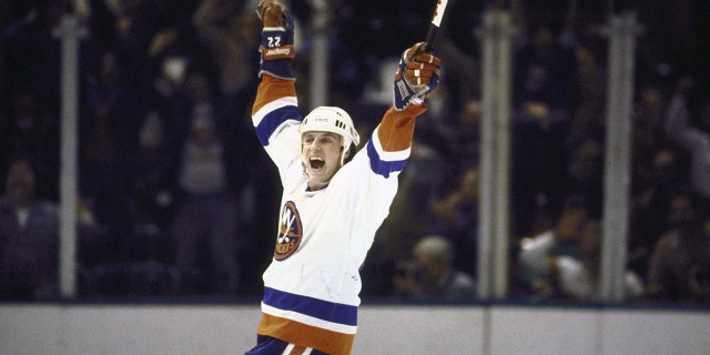 Hockey: New York Islanders Mike Bossy (22) victorious during game vs Vancouver Canucks at Nassau Coliseum. Uniondale, NY 1/8/1980