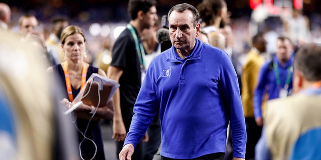 Duke Blue Devils head coach Mike Krzyzewski walks into the locker room after their loss to the North Carolina Tar Heels in the 2022 NCAA Basketball Tournament Final Four at Caesars Superdome on April 2, 2022 in New Orleans, Louisiana.