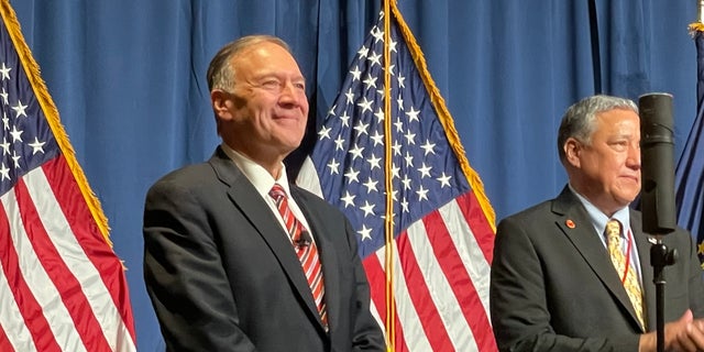Former Secretary of State Mike Pompeo is joined at the Hillsborough County, New Hampshire GOP's annual Lincoln-Reagan fundraising dinner by county chair and RNC member Chris Ager, in Manchester, N.H. on April 7, 2022