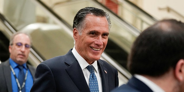 Sen. Mitt Romney, R-Utah, walks through the Senate Subway on his way to a security briefing for senators on Russia’s invasion of Ukraine, on Capitol Hill in Washington, U.S., March 30, 2022.