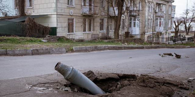 A fallen rocket that was fired from Kherson but got intercepted by Ukrainian forces remains unexploded in the street in Mykolaiv, Ukraine on April 4.