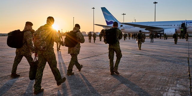 Portuguese military personnel embark at sunrise for deployment in Romania from Figo Maduro Military Airport on April 15, 2022 in Lisbon, Portugal.