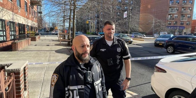 NYPD officers investigating the scene near the shooting.