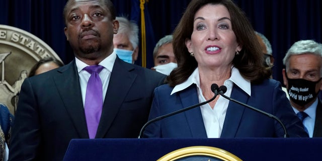 New York Gov. Kathy Hochul, accompanied by Lt. Gov. Brian Benjamin, left, speaks during ceremonies in the governor's office, in New York, Sept. 17, 2021.